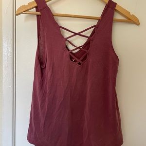 Tank top, slightly cropped and loose fighting. Worn but still in good condition
